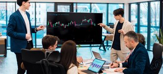 wp-2fb528ecd58958ac-two-young-worker-leading-business-meeting-about-cryptocurrencies-office