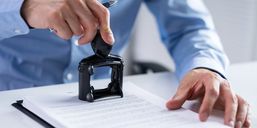 wp-38ff2a36c159ab17-Trademark,Protection,Rubber,Stamp,On,Paper,In,Office