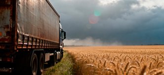 wp-45837416c5eb2f8c-truck-by-golden-wheat-field-stormy-sky