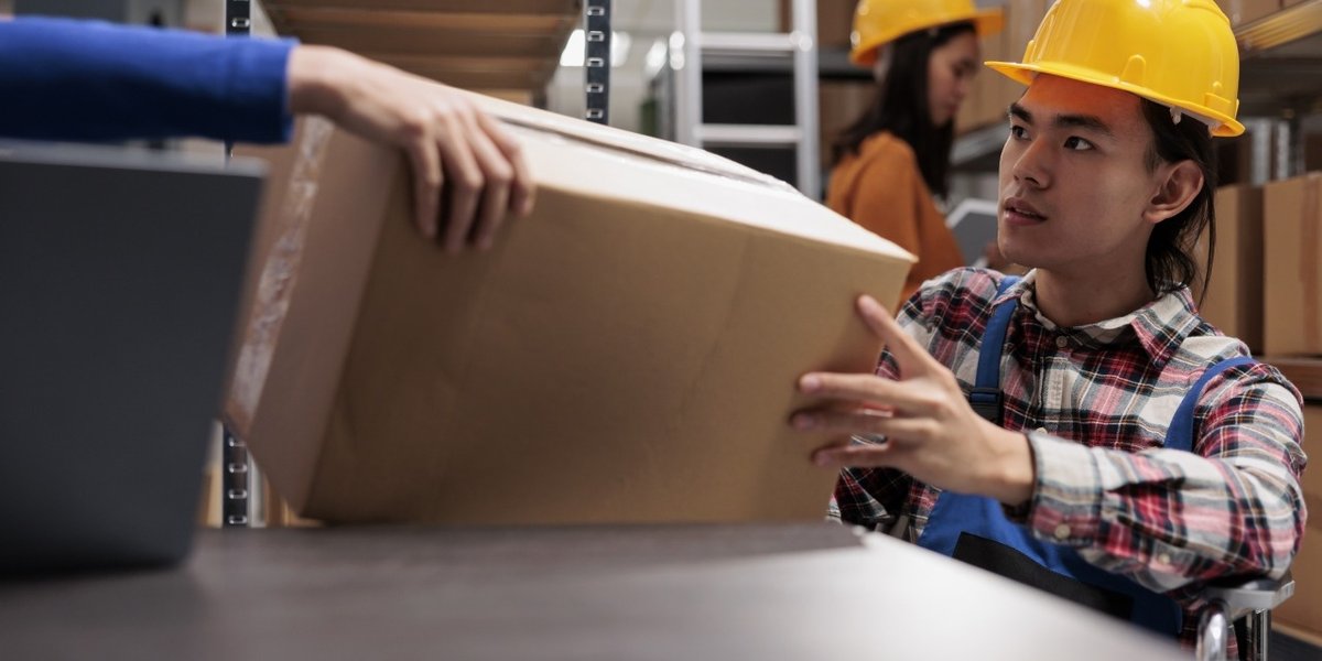 wp-47a83cadee08911a-storehouse-order-picker-wheelchair-doing-order-fulfillment-taking-cardboard-box-