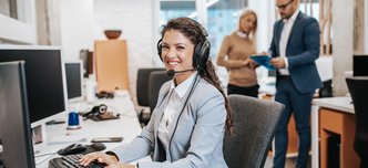 wp-55405891bfd67f28-Beautiful,Smiling,Female,Call,Center,Worker,Accompanied,By,Her,Team