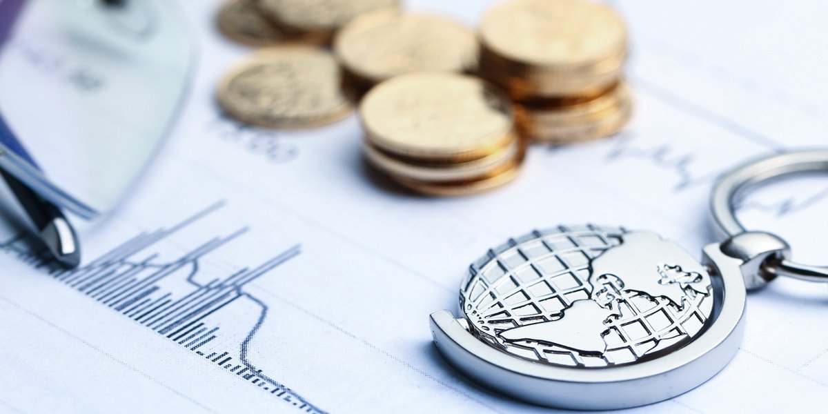 wp-5af023c8e54caaca-coins-paper-money-globe-white-statistic-form-background