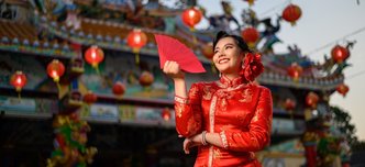 wp-624b7aa318b670c9-portrait-asian-beautiful-woman-wearing-cheongsam-smiling-holding-red-envelopes-f