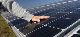 wp-b47759fa04d66c09-person-near-alternative-energy-plant