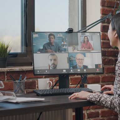 wp-c4cf00a48fb2de43-employee-talking-workmates-online-video-call-meeting-discuss-business-project-wo