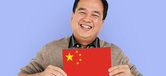 wp-ec9d2710e3140329-man-hands-hold-china-flag-patriotism