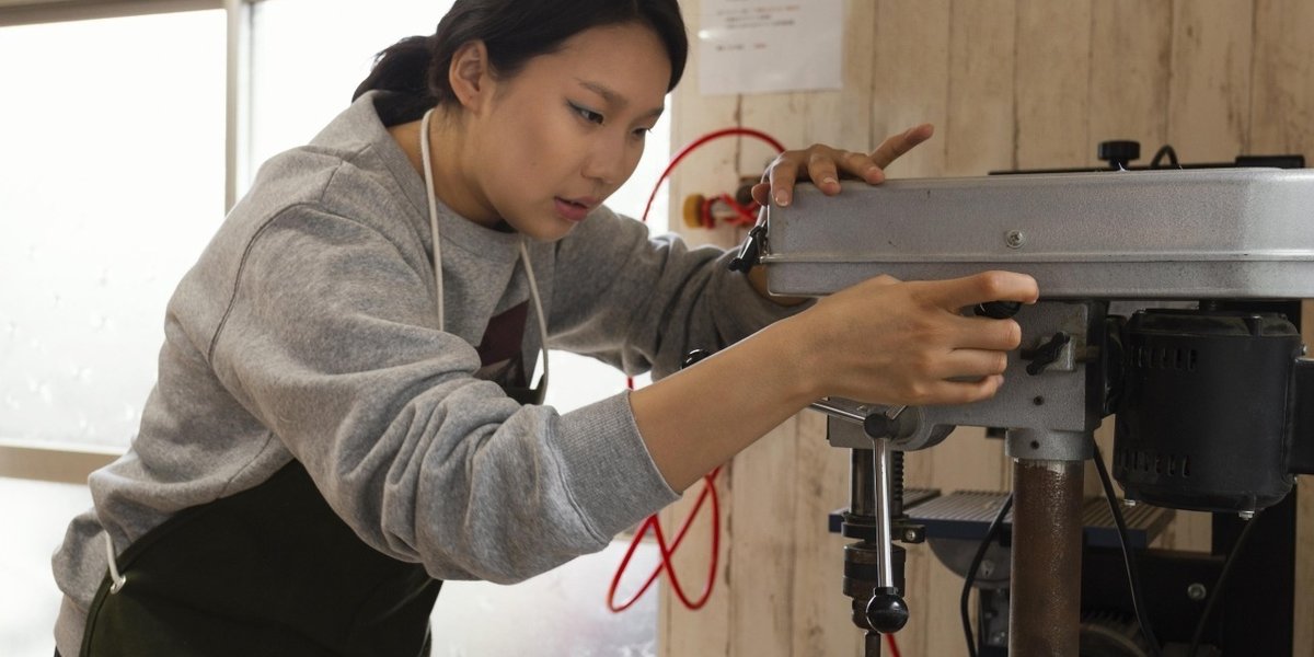 wp-ee791768ee791fa6-asian-woman-working-with-wood