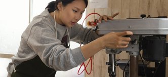 wp-ee791768ee791fa6-asian-woman-working-with-wood