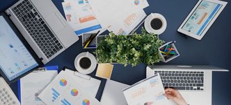 wp-f0a51b606a902025-top-view-manager-woman-analyzing-financial-paperwork-strategy-typing-expertise-l